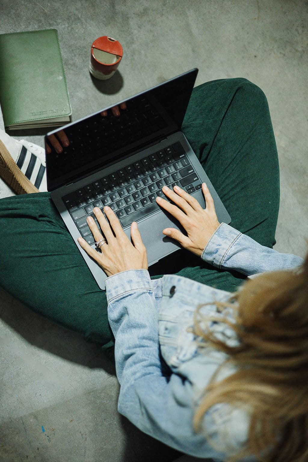 Brooke working through an AI strategy on her laptop